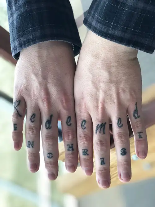 Christian tattoos on fingers